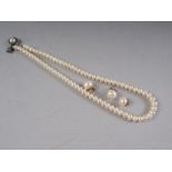 A baroque pearl single-strand necklace (approx seventy-five) with white metal clasp and three