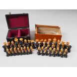 A boxwood and ebony Staunton pattern chess set, the king 2 3/4" high, and a similar set, the king