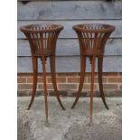A pair of Edwardian mahogany plant stands, on square tapered tripod splayed supports, 13 3/4" dia