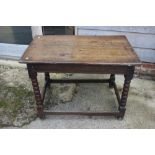 An early 18th century oak centre table, on bobbin turned and stretchered supports, 37 1/2" wide x 23