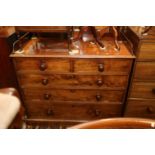 A 19th century mahogany chest of two short and three long drawers with gallery over, on block base,