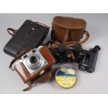 A Kodak No 3 Autographic camera, an Agfa Super Silette 35mm camera, a pair of 8x25 binoculars, a