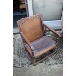 A monk's 1930s oak chair with leather seat, on splay supports, 20 1/2" wide