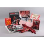 A quantity of Manchester United memorabilia, including pictures of David Beckham, Gary Neville, Eric