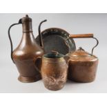 A copper jug, 14 1/2" high, another copper jug with brass rim, 6 1/2" high, a copper kettle and a
