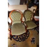 Two carved showframe chairs, button upholstered in a sage velour, on cabriole supports