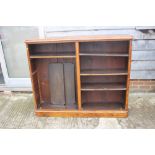 A Victorian figured walnut open bookcase, fitted adjustable shelves, on block base, 56" wide x 12"