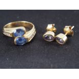 A yellow metal, stamped 750, two Sri Lankan sapphires and diamond set crossover ring, size M, and