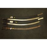 Two replica cutlasses in scabbards, blades approx 31" long, and a tulwar with cast iron grip,
