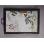 A Chinese ceramic panel with polychrome decoration of figures in a landscape, in hardwood frame, 16"