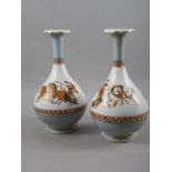 A pair of baluster vases with Classical chariot and gladiator decoration, 13 1/4" high