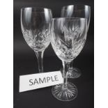 A set of eight cut glass white wine glasses, four matching red wines and three goblets