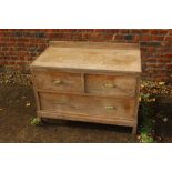 A 1930s limed oak ledge back chest of two short and one long drawer, 36" wide x 19" deep x 26" high