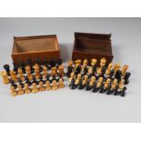 A boxwood and ebony Staunton pattern chess set, the king 3" high, and a similar set, king 2 3/4"