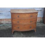 A 19th century mahogany bowfront chest of three graduated long drawers with brass ring handles, on