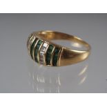 A yellow metal dress ring, stamped 750, set emeralds and diamonds, 5.0g gross, size R