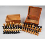 A boxwood and ebony Staunton pattern chess set, the king 3 1/4" high, and a similar set, the King