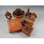 A box with cherub marquetry decoration, a similar box, a carved abstract figure, 9 1/2" high, a