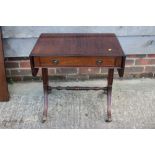 A mahogany flap top low occasional table, fitted one long drawer, on splay supports, 24" wide x