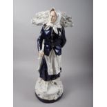 A Royal Dux porcelain figure of a faggot gatherer, 12 1/2" high