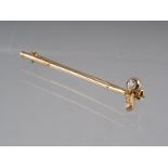 A 9ct gold tie pin/bar brooch, formed as a golf club, set single diamond, 2.3g gross