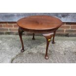 An oak oval drop leaf low occasional table, on gate leg support, 21" wide x 26" deep x 19" high, a