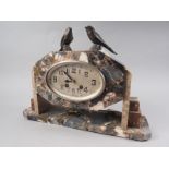 An Art Deco coloured marble mantel clock with pheasant surmount, 11" high