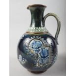 A Doulton Burslem jug with relief bird and tree decoration, 8" high
