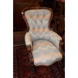 A 19th century mahogany showframe armchair, upholstered in a Florentine fabric, on turned supports