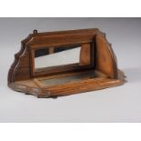 An oak corner wall bracket with shaped top and mirrored back, 19 3/4" high