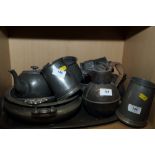 A quantity of pewter, including a Jersey jug, 7 1/4" high, a teapot, a tea caddy and other items