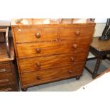 A 19th century mahogany chest of two short and three long drawers with knob handles, on bun feet,
