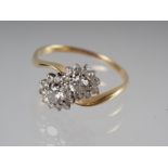 An 18ct gold crossover cluster ring set twenty-two diamonds, total ring 1ct approx, size O 1/2, 3.7g