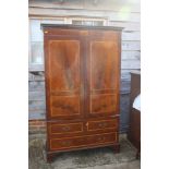 A Georgian figured mahogany and satinwood banded bookcase enclosed two doors over two short and