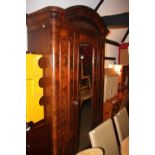 A late 19th century figured walnut wardrobe, interior fitted two drawers and shelves enclosed mirror