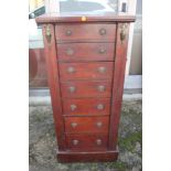 A 19th century "Wellington" chest of seven graduated long drawers with ring handles, on block