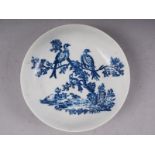 An 18th century Worcester blue and white saucer, decorated birds in a tree, 5" dia