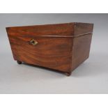 A 19th century mahogany coffee caddy with silver foil lining and original company label inside, on