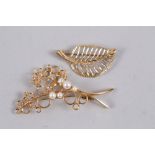 A 9ct gold and pearl floral spray brooch, 4.8g, and a 9ct gold leaf form brooch, 2.9g