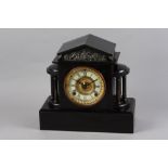 A late 19th century black japanned mantel clock with half-hour striking movement, 11 1/4" high (