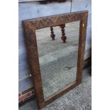 A carved hardwood framed wall mirror, plate 23" x 35"