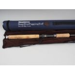 A Greys Sportfish IM6 8ft fishing rod, in brown velour case and Showbee Deep Blue Popping Rod