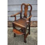 A child's Georgian mahogany high chair with plain shaped splat and footrest