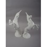 Two Michael Sutty bone china models of unicorns, larger 10" high