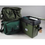 Two soft green fishing bags and a similar hard case containing fishing equipment