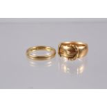 An 18ct gold buckle ring, size N, 6.7g, and an 18ct gold wedding band, size M, 3.6g