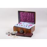 A marquetry inlaid jewellery box, containing a selection of costume jewellery, coins, a Lusitania