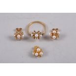 A suite of 9ct gold and pearl jewellery comprising ear studs, pendant and dress ring, size P, 8.3g