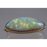 A Victorian yellow metal brooch, stamped 9ct, set vibrant coloured Australian opal, 32mm x 14mm