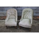 A pair of Victorian button back nursing chairs, upholstered in green velour